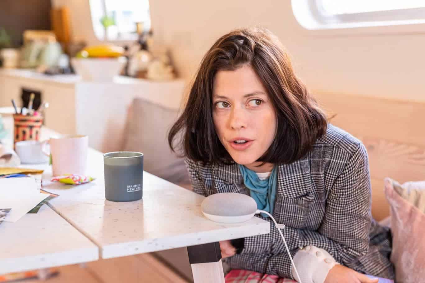 woman speaking into smart speaker