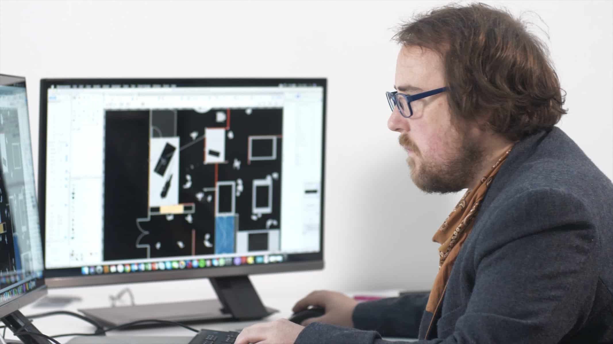 staff working on a floor plan for a new immersive museum space in Australia