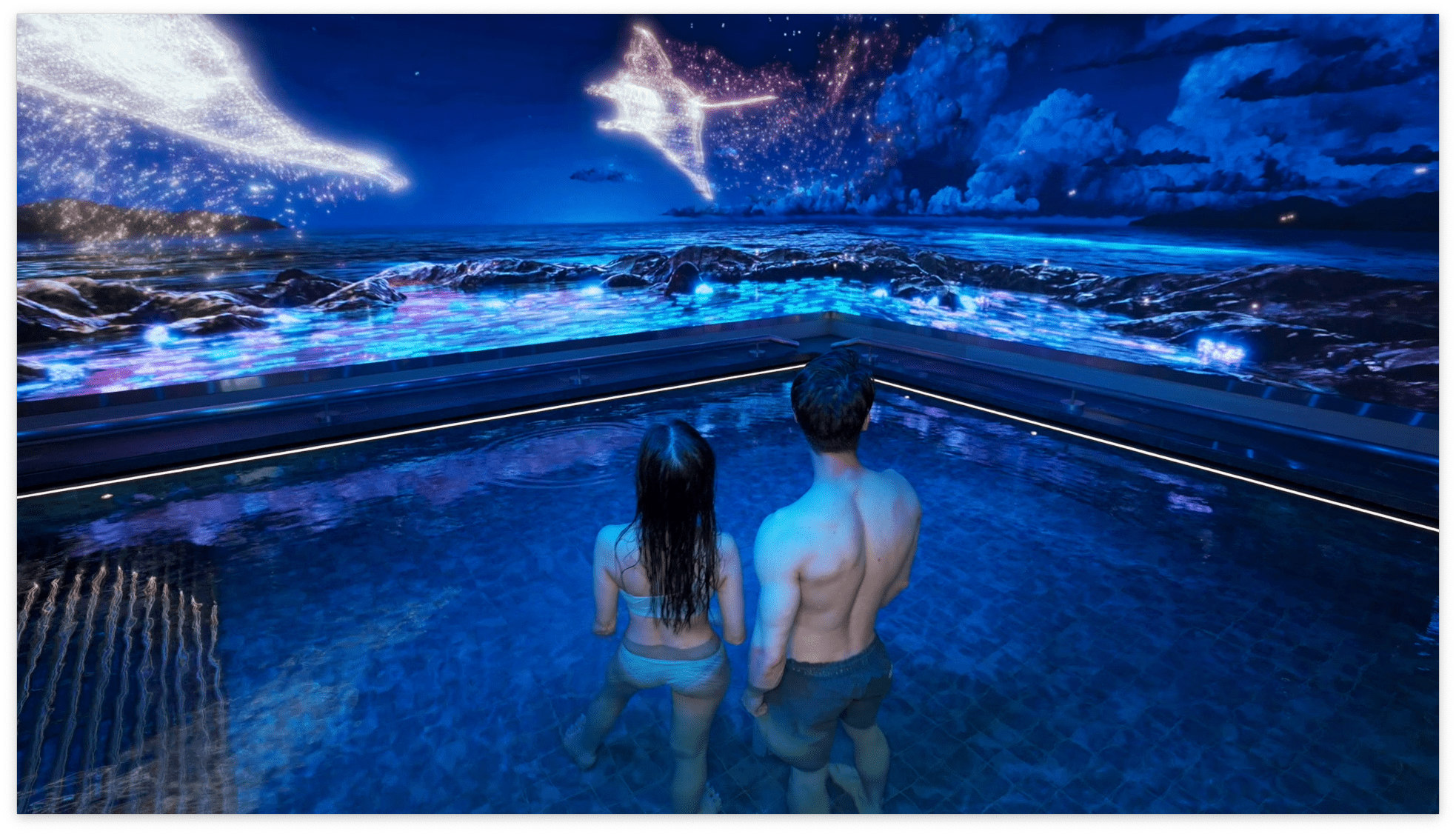 Guest looking at an immersive screen showing mantas at the Tria Spa in Macau